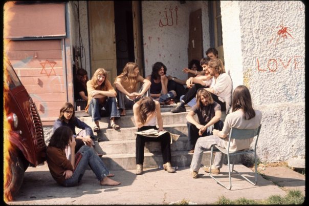 group sitting on entrance steps